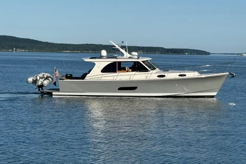  Yacht Photos Pics 2017 Grand Banks 44 Eastbay SX yacht cruising on calm waters.