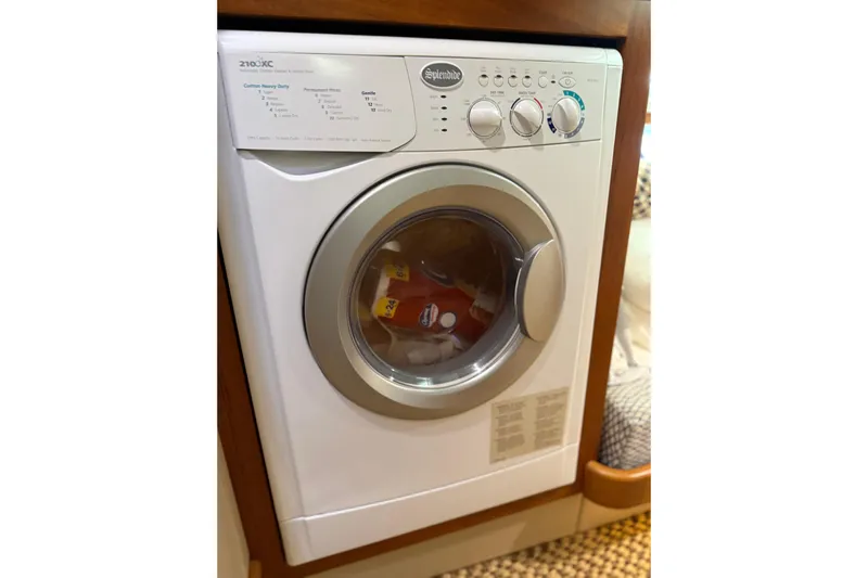 Yacht Photos Pics Washing machine inside 2017 Grand Banks 44 Eastbay SX yacht interior.