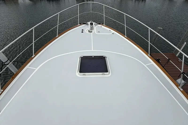  Yacht Photos Pics Bow view of 2017 Grand Banks 44 Eastbay SX yacht on water.