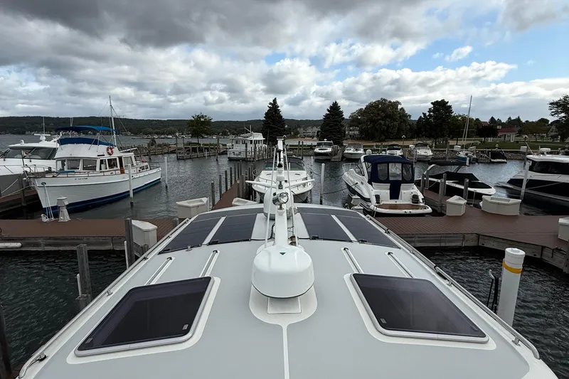  Yacht Photos Pics 2017 Grand Banks 44 Eastbay SX docked at a marina under cloudy skies.