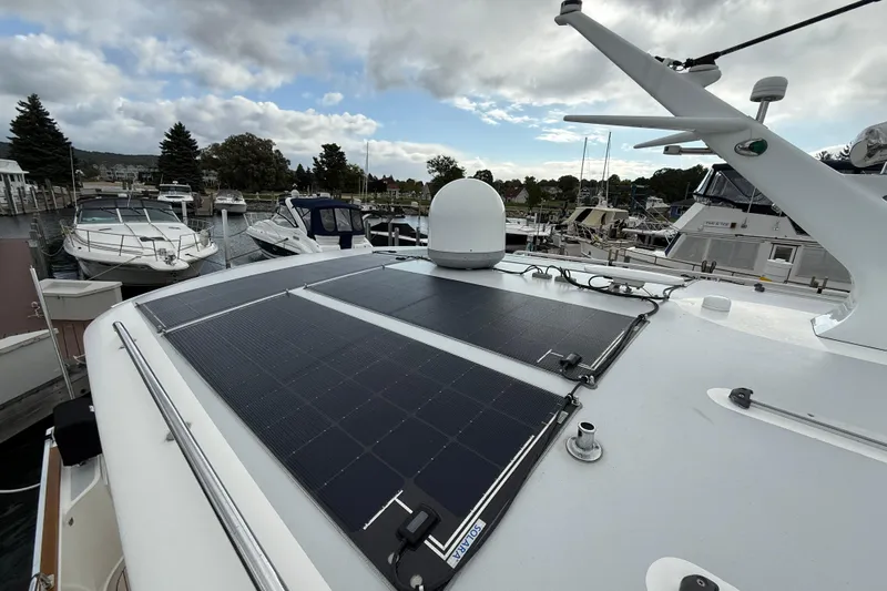  Yacht Photos Pics 2017 Grand Banks 44 Eastbay SX with solar panels docked at a marina.