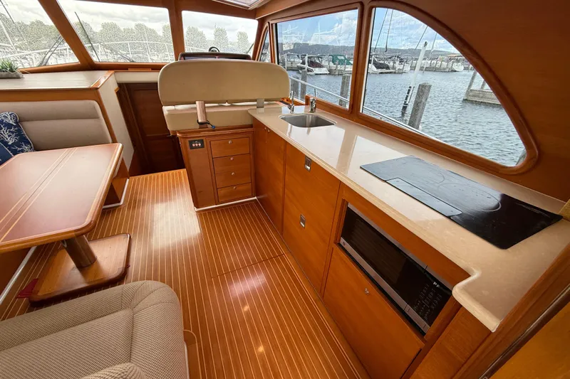  Yacht Photos Pics Luxurious interior of 2017 Grand Banks 44 Eastbay SX yacht with wood finish and modern amenities.