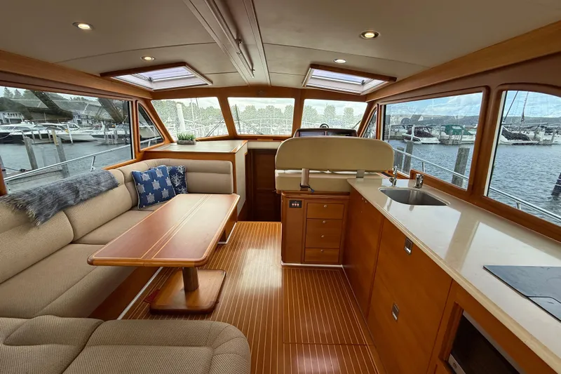  Yacht Photos Pics Luxurious interior of 2017 Grand Banks 44 Eastbay SX yacht with elegant wood finishes.