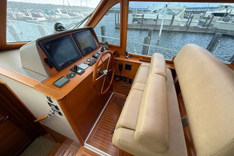  Yacht Photos Pics 2017 Grand Banks 44 Eastbay SX helm with navigation screens and leather seating.