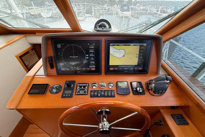  Yacht Photos Pics Helm of 2017 Grand Banks 44 Eastbay SX with navigation screens and controls.