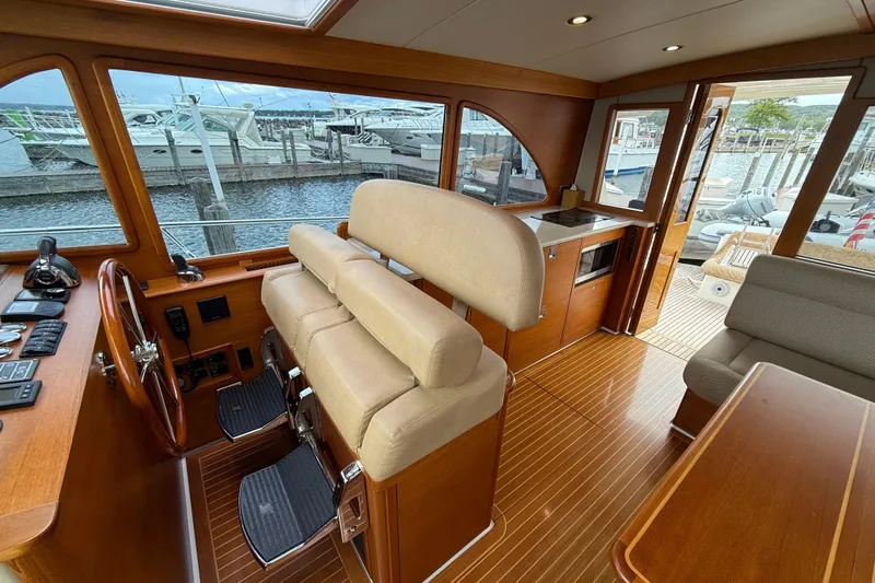  Yacht Photos Pics Interior of 2017 Grand Banks 44 Eastbay SX yacht with helm and seating area.