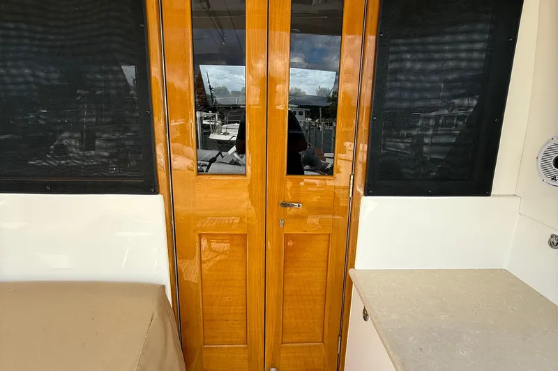  Yacht Photos Pics Wooden door and windows on 2017 Grand Banks 44 Eastbay SX yacht interior.