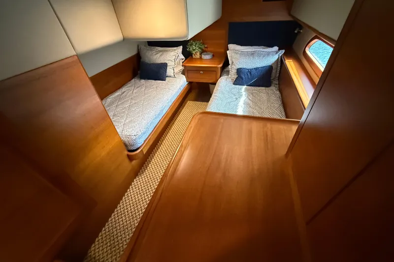  Yacht Photos Pics 2017 Grand Banks 44 Eastbay SX cabin with twin beds and wooden interior.