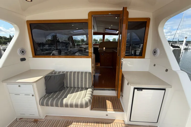  Yacht Photos Pics Luxurious 2017 Grand Banks 44 Eastbay SX yacht interior with seating and wooden accents.
