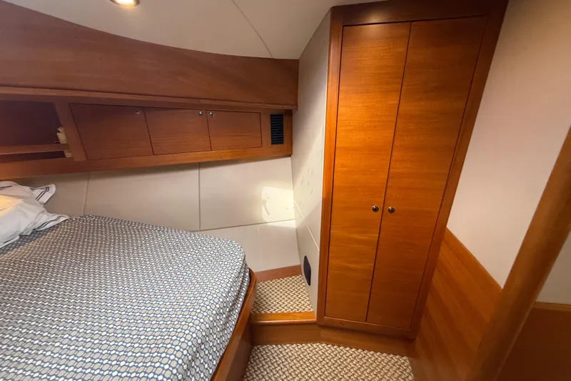  Yacht Photos Pics Luxurious cabin interior of 2017 Grand Banks 44 Eastbay SX yacht with wooden cabinetry.