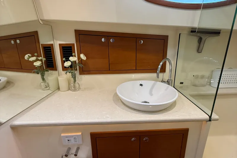  Yacht Photos Pics Luxurious bathroom interior of 2017 Grand Banks 44 Eastbay SX yacht with elegant sink.