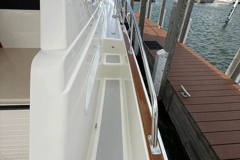  Yacht Photos Pics 2017 Grand Banks 44 Eastbay SX yacht docked, showcasing sleek side deck and railing.