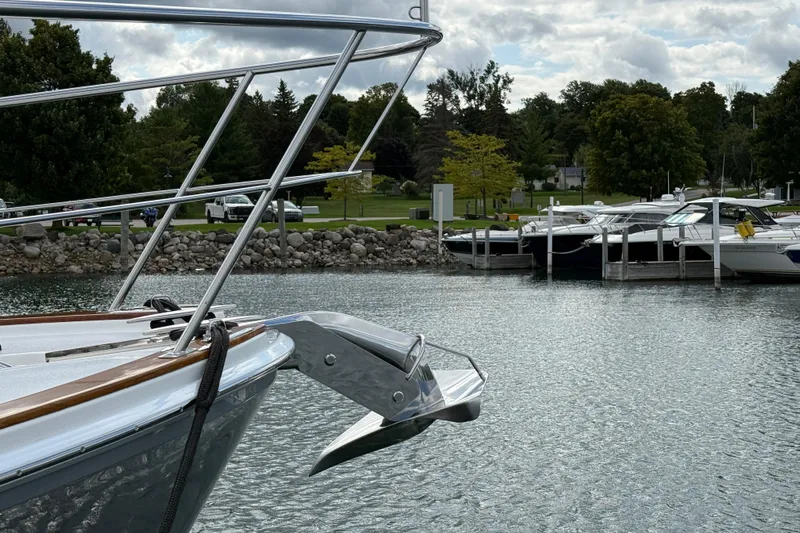  Yacht Photos Pics 2017 Grand Banks 44 Eastbay SX yacht anchored in a serene marina setting.
