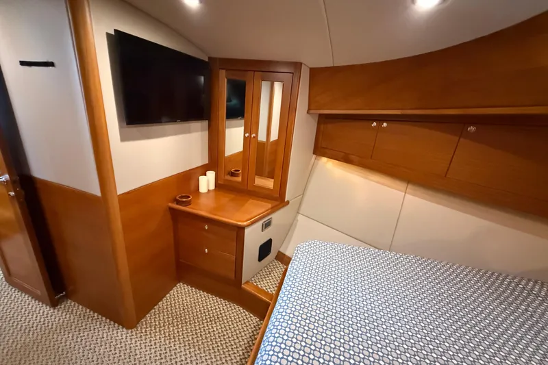  Yacht Photos Pics Luxurious cabin interior of 2017 Grand Banks 44 Eastbay SX yacht with wood finishes.