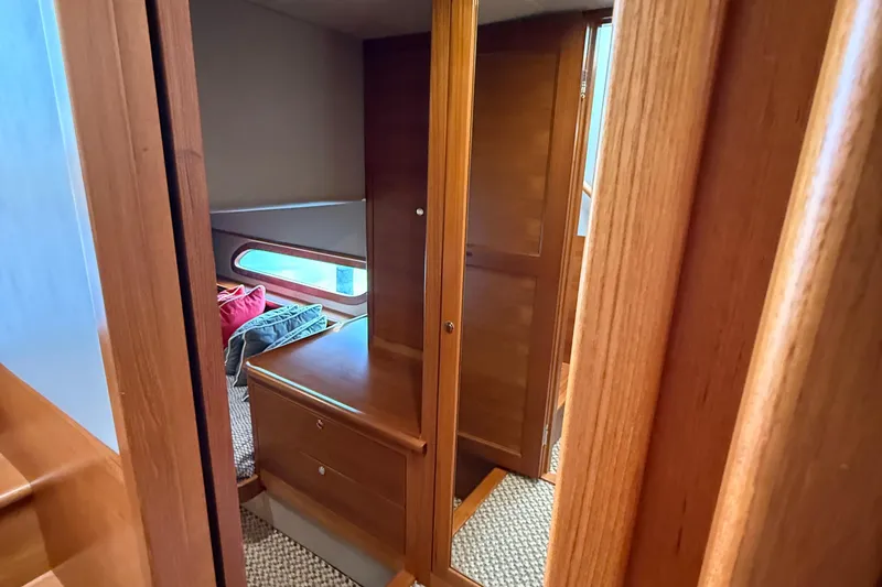 Yacht Photos Pics Interior of 2017 Grand Banks 44 Eastbay SX with wooden cabinetry and cozy cabin space.