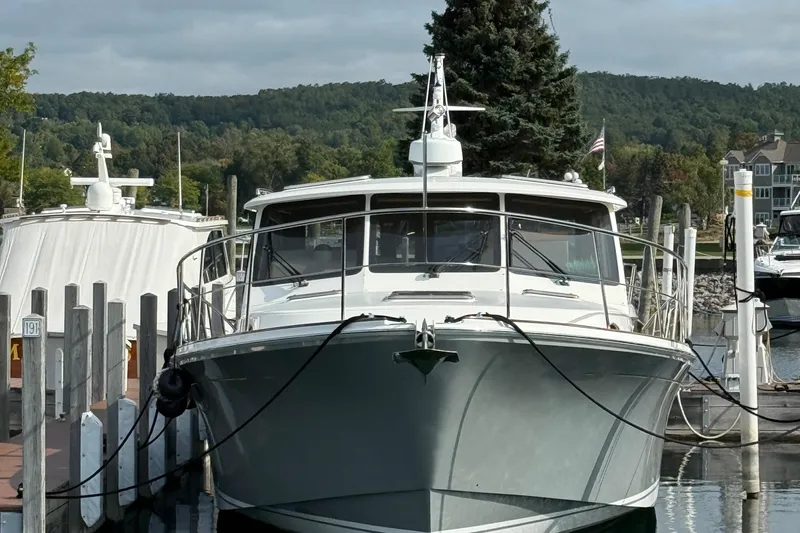  Yacht Photos Pics 2017 Grand Banks 44 Eastbay SX yacht docked at a marina with scenic background.
