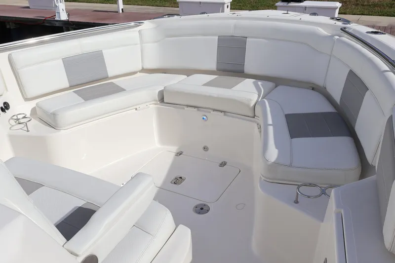  Yacht Photos Pics 2021 Pursuit S 328 Sport boat interior with white and gray seating.