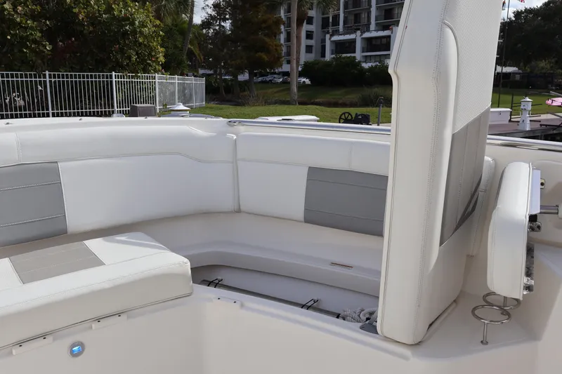  Yacht Photos Pics 2021 Pursuit S 328 Sport boat interior with white and gray seating.