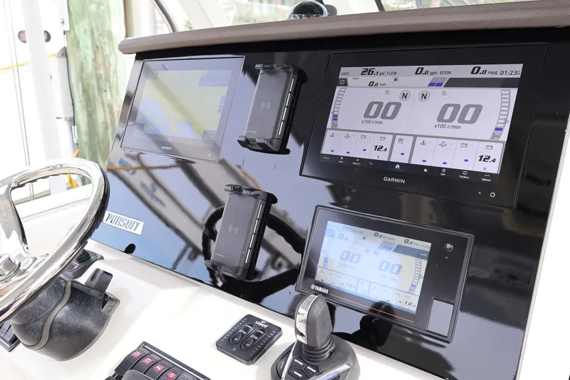  Yacht Photos Pics 2021 Pursuit S 328 Sport dashboard with Garmin navigation and control displays.