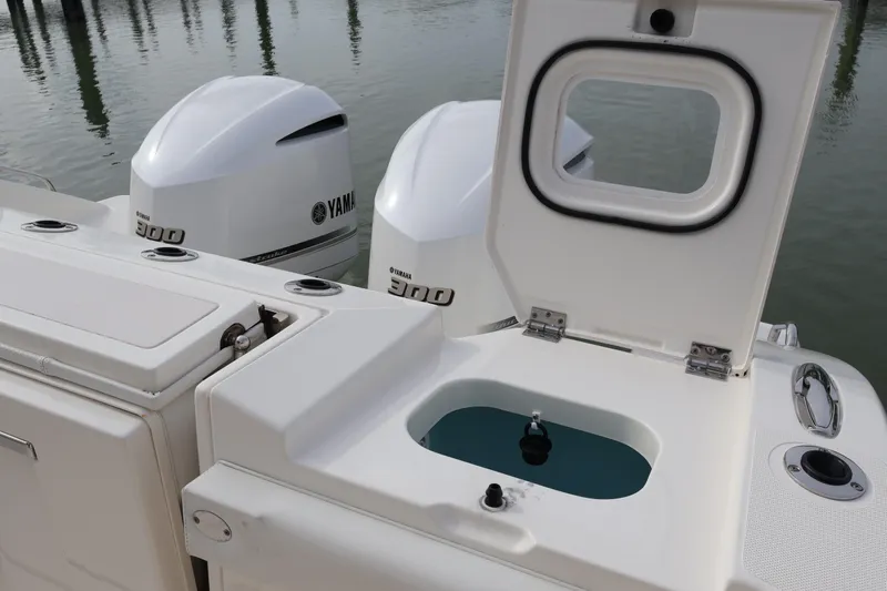 Yacht Photos Pics 2021 Pursuit S 328 Sport boat with Yamaha 300 engines and open storage compartment.