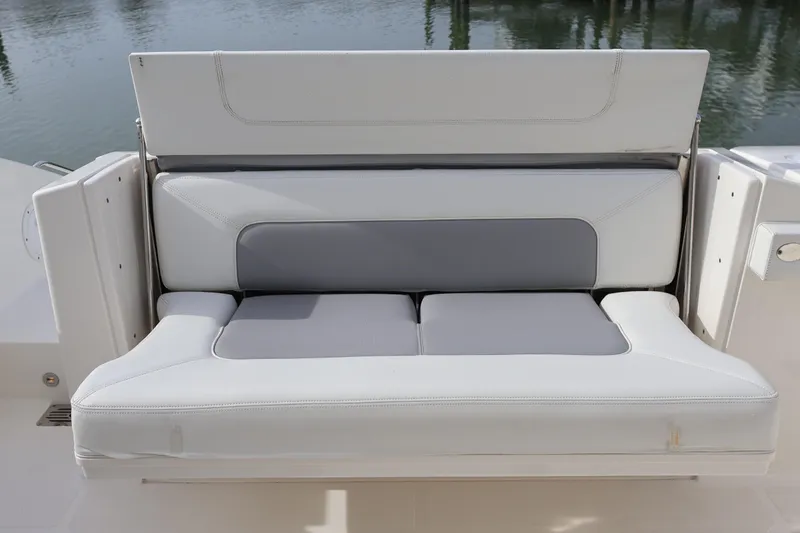  Yacht Photos Pics 2021 Pursuit S 328 Sport boat seat with white and gray upholstery.