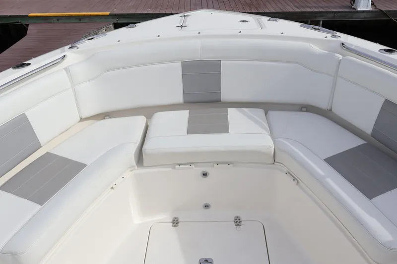  Yacht Photos Pics 2021 Pursuit S 328 Sport boat with white and gray cushioned seating.