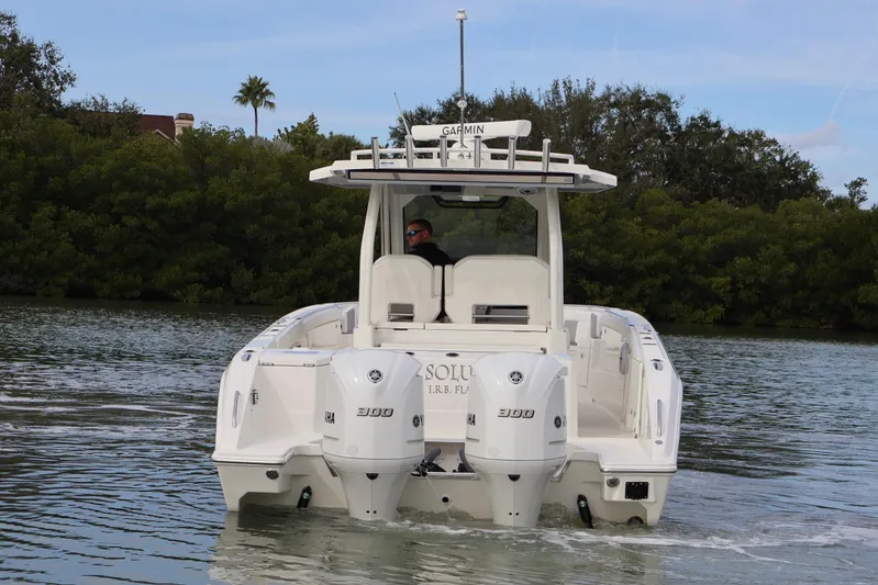  Yacht Photos Pics 2021 Pursuit S 328 Sport boat on calm water.