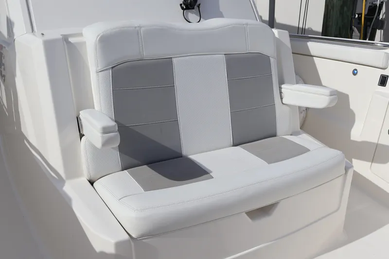  Yacht Photos Pics 2021 Pursuit S 328 Sport boat seat with white and gray upholstery.