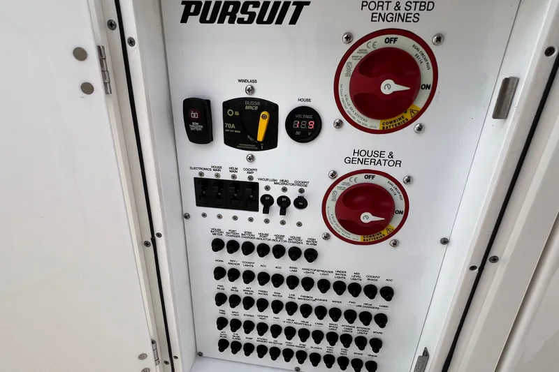  Yacht Photos Pics Control panel of 2021 Pursuit S 328 Sport boat with switches and dials.
