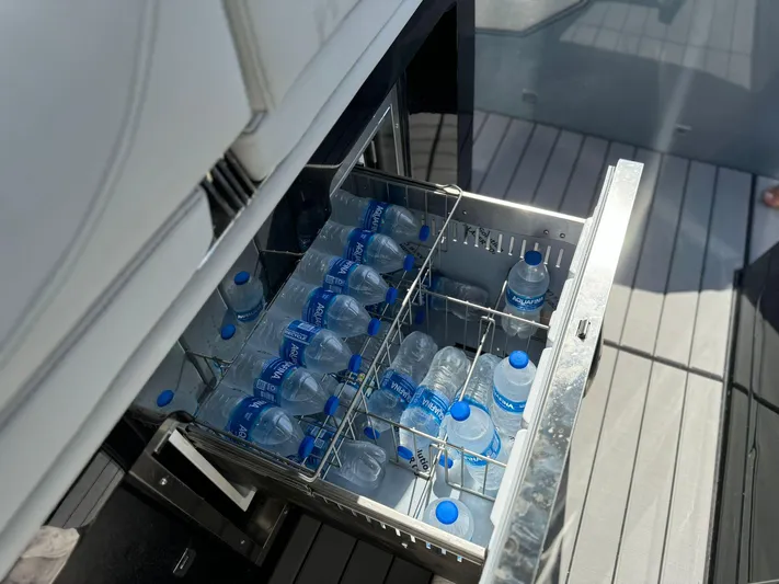  Yacht Photos Pics Open drawer fridge with water bottles on Ranieri CAYMAN 38.0 EXECUTIVE, 2025 model.