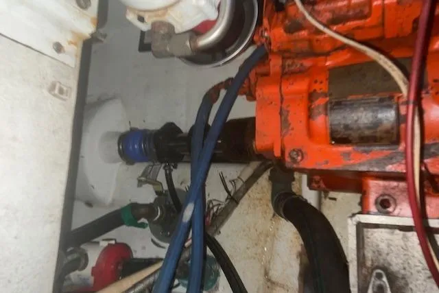 Bad Habits Yacht Photos Pics Engine compartment of a 2002 Libby 38 Downeast boat, showing mechanical components and hoses.