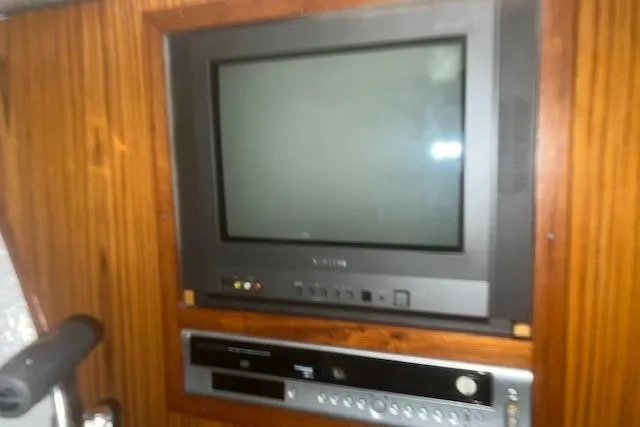 Bad Habits Yacht Photos Pics Vintage TV and DVD player in 2002 Libby 38 Downeast boat interior.