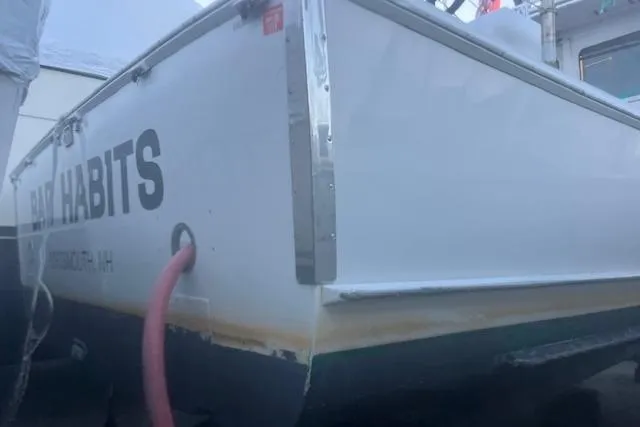 Bad Habits Yacht Photos Pics 2002 Libby 38 Downeast boat with visible name and docked in a harbor.