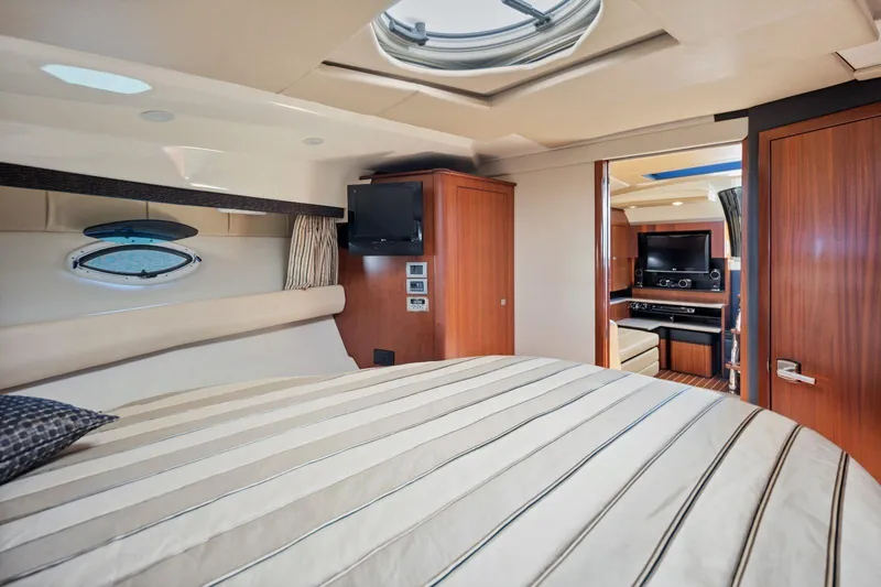  Yacht Photos Pics Luxurious interior of 2012 Monterey 400 Sport Yacht with cozy bedroom and entertainment area.