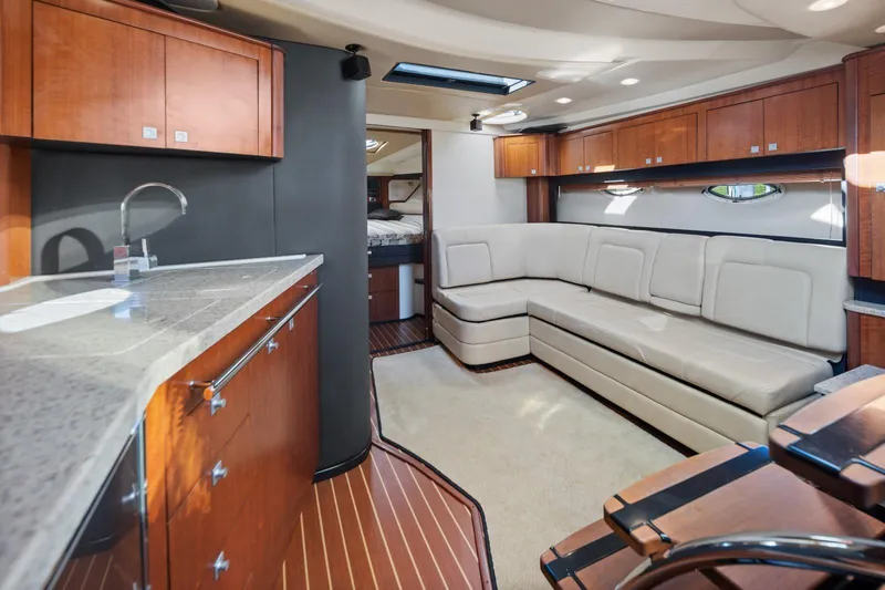  Yacht Photos Pics Luxurious interior of 2012 Monterey 400 Sport Yacht with modern kitchen and seating area.