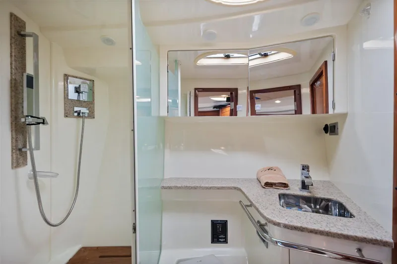  Yacht Photos Pics Luxurious bathroom in 2012 Monterey 400 Sport Yacht with modern fixtures and granite countertop.