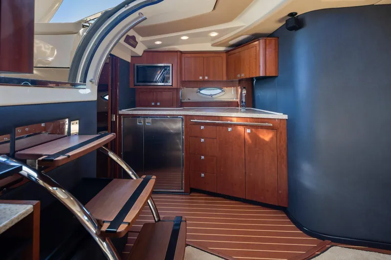  Yacht Photos Pics Interior of 2012 Monterey 400 Sport Yacht with modern kitchen and wooden cabinetry.