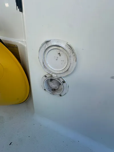 Marking Time Yacht Photos Pics Close-up of Jeanneau Merry Fisher 855 boat fittings, 2016 model, featuring circular access panels.