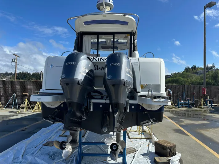 Marking Time Yacht Photos Pics 2016 Jeanneau Merry Fisher 855 with twin 150 horsepower engines, docked outdoors.