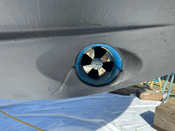 Marking Time Yacht Photos Pics Bow thruster on 2016 Jeanneau Merry Fisher 855 boat hull.