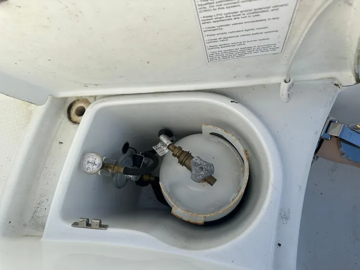 Marking Time Yacht Photos Pics Propane tank compartment on a 2016 Jeanneau Merry Fisher 855 boat.