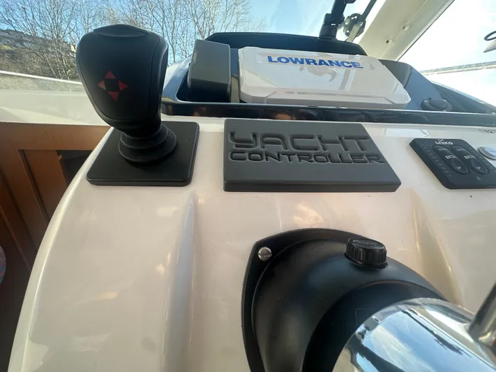 Marking Time Yacht Photos Pics Control panel of 2016 Jeanneau Merry Fisher 855 with yacht controller and Lowrance device.
