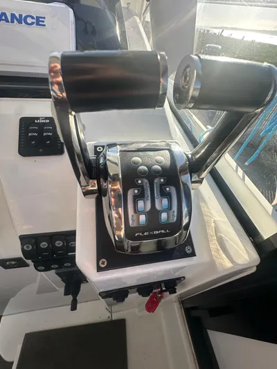 Marking Time Yacht Photos Pics Throttle controls on a 2016 Jeanneau Merry Fisher 855 boat cockpit.