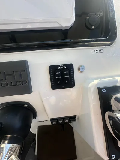 Marking Time Yacht Photos Pics Control panel of a 2016 Jeanneau Merry Fisher 855 boat with Lenco trim tab switches.