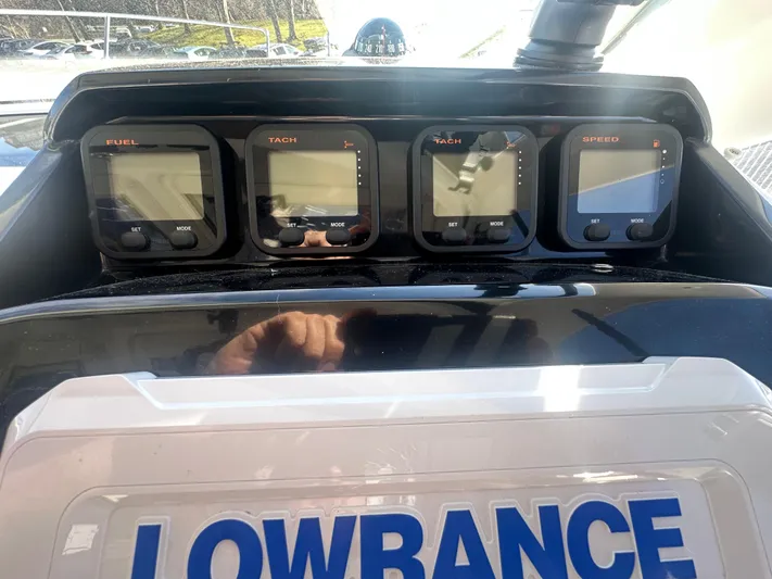 Marking Time Yacht Photos Pics Dashboard of 2016 Jeanneau Merry Fisher 855 with Lowrance display and gauges.