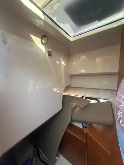 Marking Time Yacht Photos Pics Interior cabin of 2016 Jeanneau Merry Fisher 855 boat with skylight.