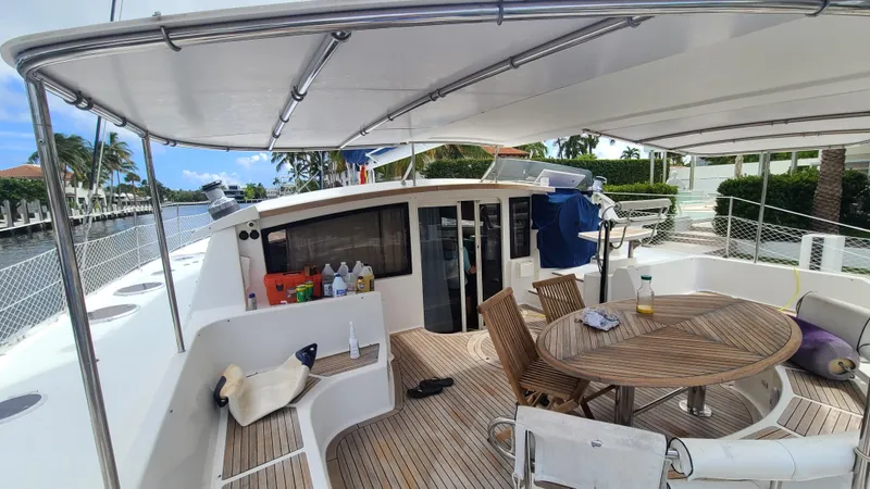 Pono Yacht Photos Pics 2005 Fountaine Pajot FP Eleuthera 60 yacht deck with seating and table.
