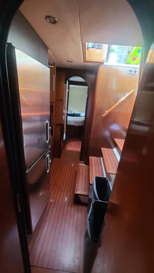 Pono Yacht Photos Pics Interior of 2005 Fountaine Pajot FP Eleuthera 60 yacht, featuring wooden flooring and modern design.