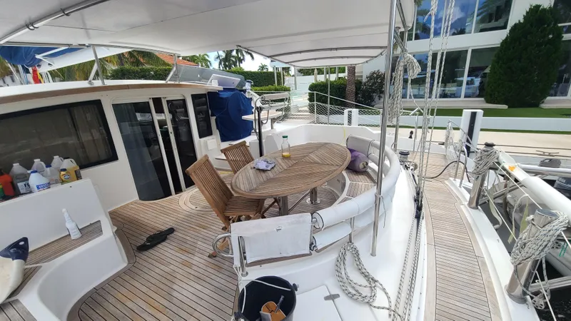 Pono Yacht Photos Pics Spacious deck of 2005 Fountaine Pajot FP Eleuthera 60 catamaran with outdoor seating.