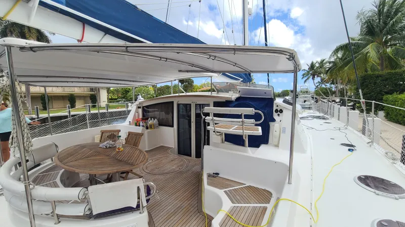 Pono Yacht Photos Pics Fountaine Pajot FP Eleuthera 60 yacht, 2005 model, featuring spacious deck and seating area.